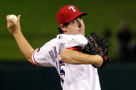 ARLINGTON, TX - OCTOBER 23: Derek Holland #45 of the Texas Rangers pitches during Game Four of the MLB World Series against the St. Louis Cardinals at Rangers Ballpark in Arlington on October 23, 2011 in Arlington, Texas. (Photo by Tony Gutierrez-Pool/Getty Images)
