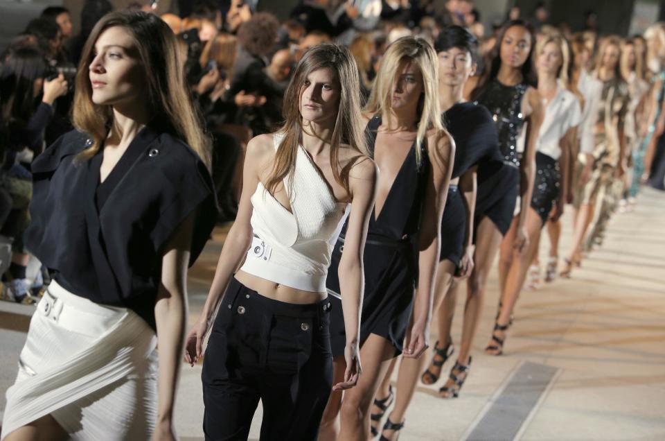 Models wear a creation as part of fashion designer Anthony Vaccarello's spring-summer 2013 ready to wear collection in Paris, Tuesday, Sept. 25, 2012. (AP Photo/Francois Mori)