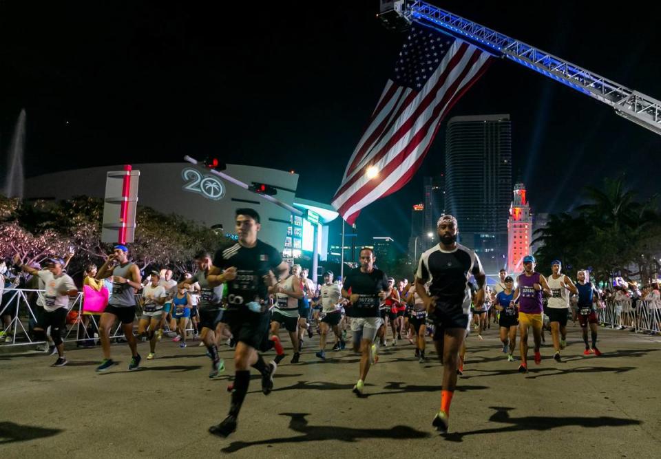 Runners take off from the starting line of the 20th annual Life Time Miami Marathon and Half Marathon in downtown Miami, Florida on Sunday, February 6, 2022. More than 15,000 combined runners participated in the marathon and half marathon.