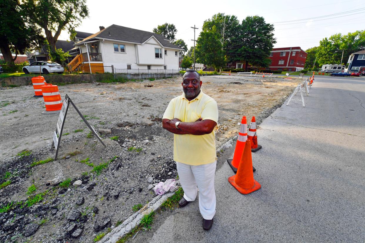 Eric Johnson, pastor of the Greater Galilee Baptist Church, stands in front of a lot at the intersection of 40th Street and West Broadway. He wants to build a covered basketball court there to drive economic development