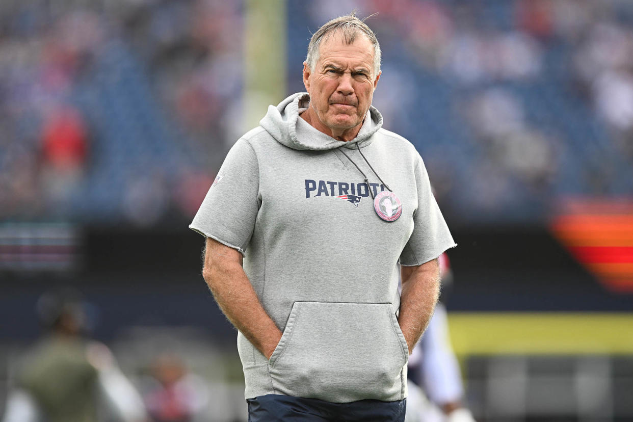 Bill Belichick wears a hoodie at 2022 game. (Kathryn Riley / Getty Images)