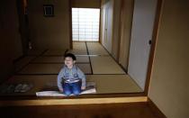 Five-year-old Atsunori Kaneta smiles at his home in Koriyama, west of the tsunami-crippled Fukushima Daiichi nuclear power plant, Fukushima prefecture February 28, 2014. REUTERS/Toru Hanai