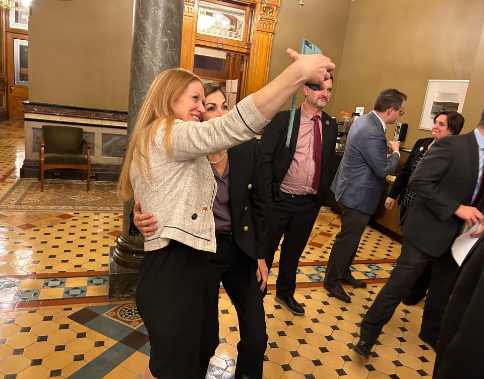 Senate President Amy Sinclair takes a selfie with Gov. Kim Reynolds after the Senate passed the private school scholarships bill.