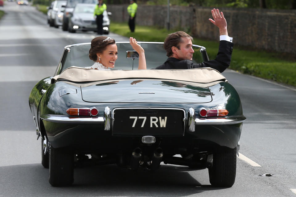 The bride and groom leave&nbsp;in a classic car.&nbsp;