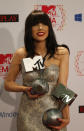 Canadian singer Carly Rae Jepsen shows off her both awards during the 2012 MTV European Music Awards show at the Festhalle in Frankfurt, central Germany, Sunday, Nov. 11, 2012. (AP Photo/Frank Augstein)