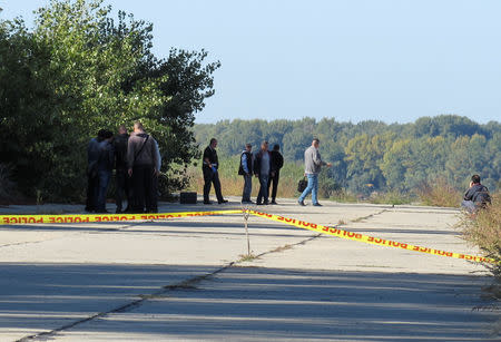 Police investigators walk near a crime scene where TV journalist Viktoria Marinova was murdered in Ruse, Bulgaria October 7, 2018. Ruse Media/Bulphoto via Reuters