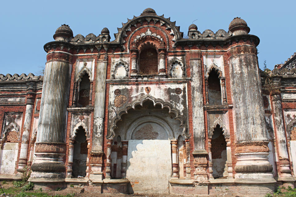 Tall pilasters, fluted pillars and scalloped arches in distintly european style blended with Indian elements,wall of old palace Darbhanga, Bihar, India