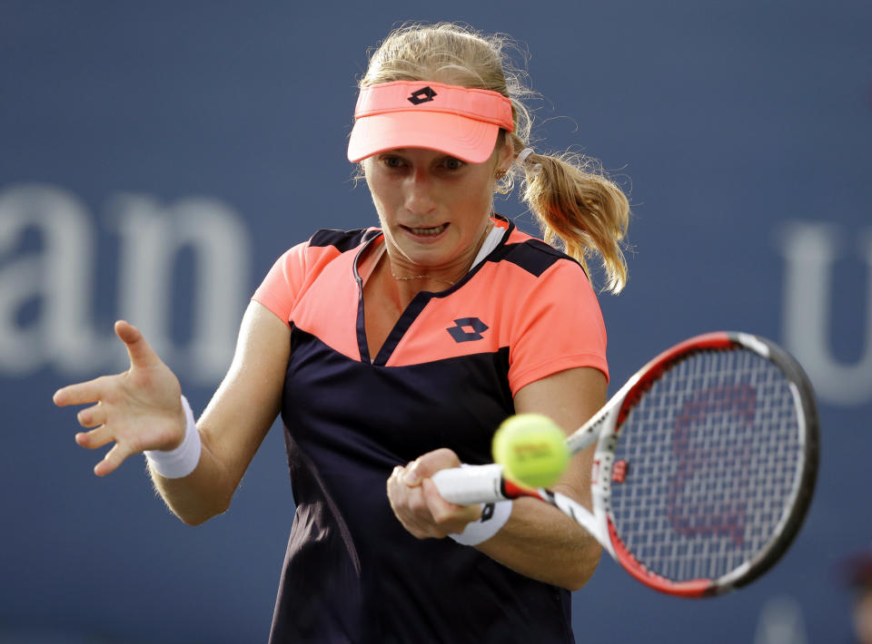 Ekaterina Makarova, of Russia, returns a shot to Slovenia's Polona Hercog during the first round of the 2013 U.S. Open tennis tournament Monday, Aug. 26, 2013, in New York. (AP Photo/Darron Cummings)