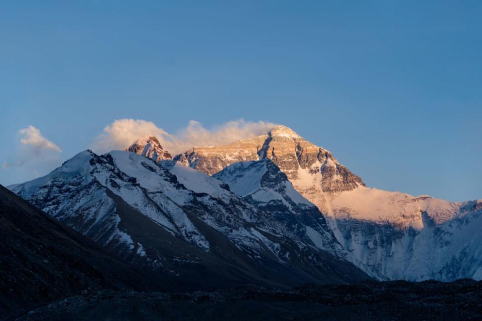 <div class="inline-image__caption"><p>Sunlight touches the top of Mt. Everest.</p></div> <div class="inline-image__credit">National Geographic/Renan Ozturk</div>