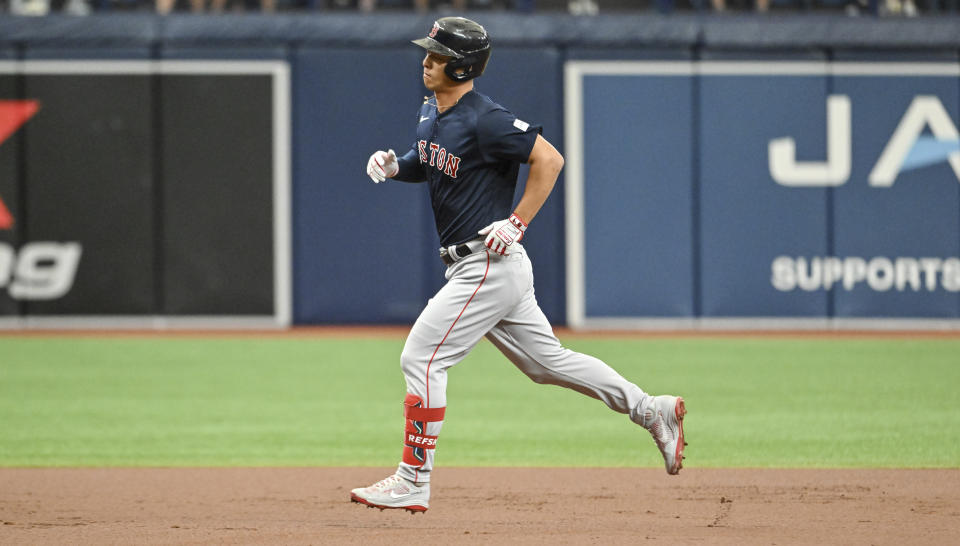 Boston Red Sox's Rob Refsnyder circles the bases after hitting a solo home run off Tampa Bay Rays starter Jeffrey Springs during the first inning of a baseball game Thursday, April 13, 2023, in St. Petersburg, Fla. (AP Photo/Steve Nesius)