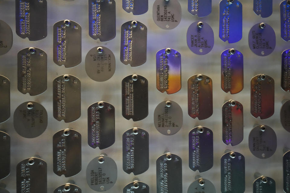 Replicas of real dog tags worn by U.S. soldiers in World War II cover the entry wall to the new pavilion that will be opening at the National World War II Museum, in New Orleans, Tuesday, Oct. 31, 2023. The latest major addition to the museum is called the Liberation Pavilion. And it's ambitious in scope. The grim yet hopeful addition addresses the conflict's world-shaping legacy. (AP Photo/Gerald Herbert)