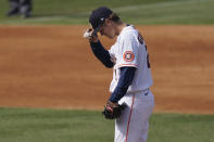 Houston Astros pitcher Zack Greinke grabs his cap on the mound during the fifth inning of Game 4 of a baseball American League Division Series against the Oakland Athletics in Los Angeles, Thursday, Oct. 8, 2020. (AP Photo/Ashley Landis)