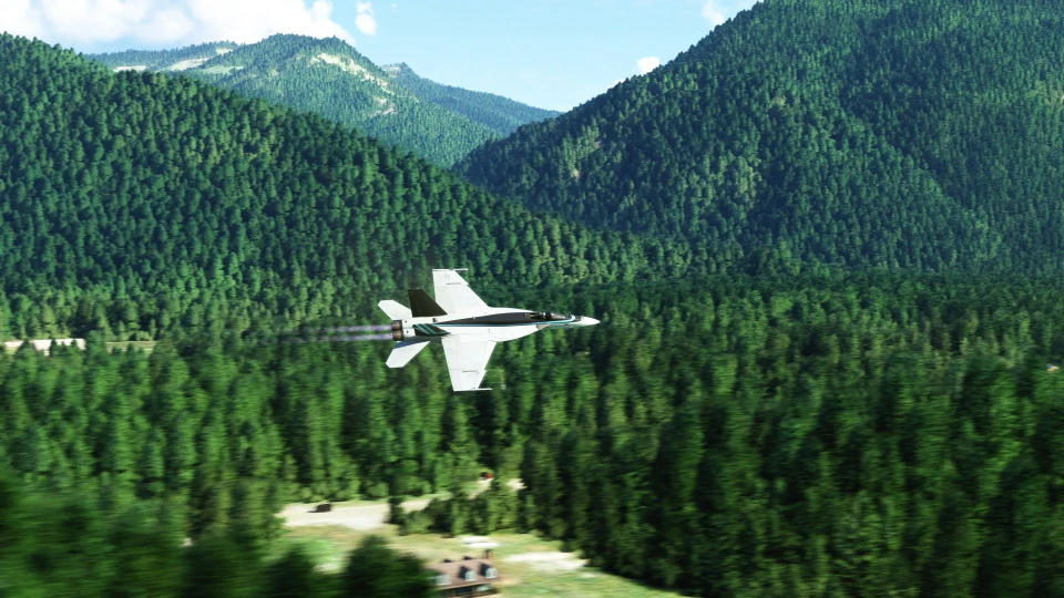 Airplane near mountains and a lake