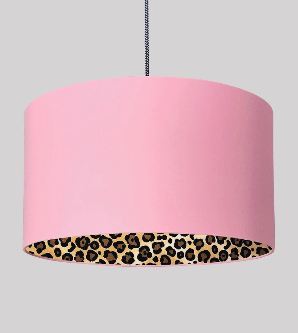 <p>An accent piece to say the least. This quirky Love Frankie piece has a soft bubblegum pink outer, and luminous leopard print inner for a warm glow. This lampshade can be used for table lamps, floor lamps, or as a ceiling pendant.</p><p><strong>Shop now:</strong><strong> <a href="https://www.swooneditions.com/LF-LEOP-CF?sku=LF-LEOP-CF-12x10" rel="nofollow noopener" target="_blank" data-ylk="slk:Love Frankie Silhouette Lampshade;elm:context_link;itc:0;sec:content-canvas" class="link ">Love Frankie Silhouette Lampshade</a></strong></p>