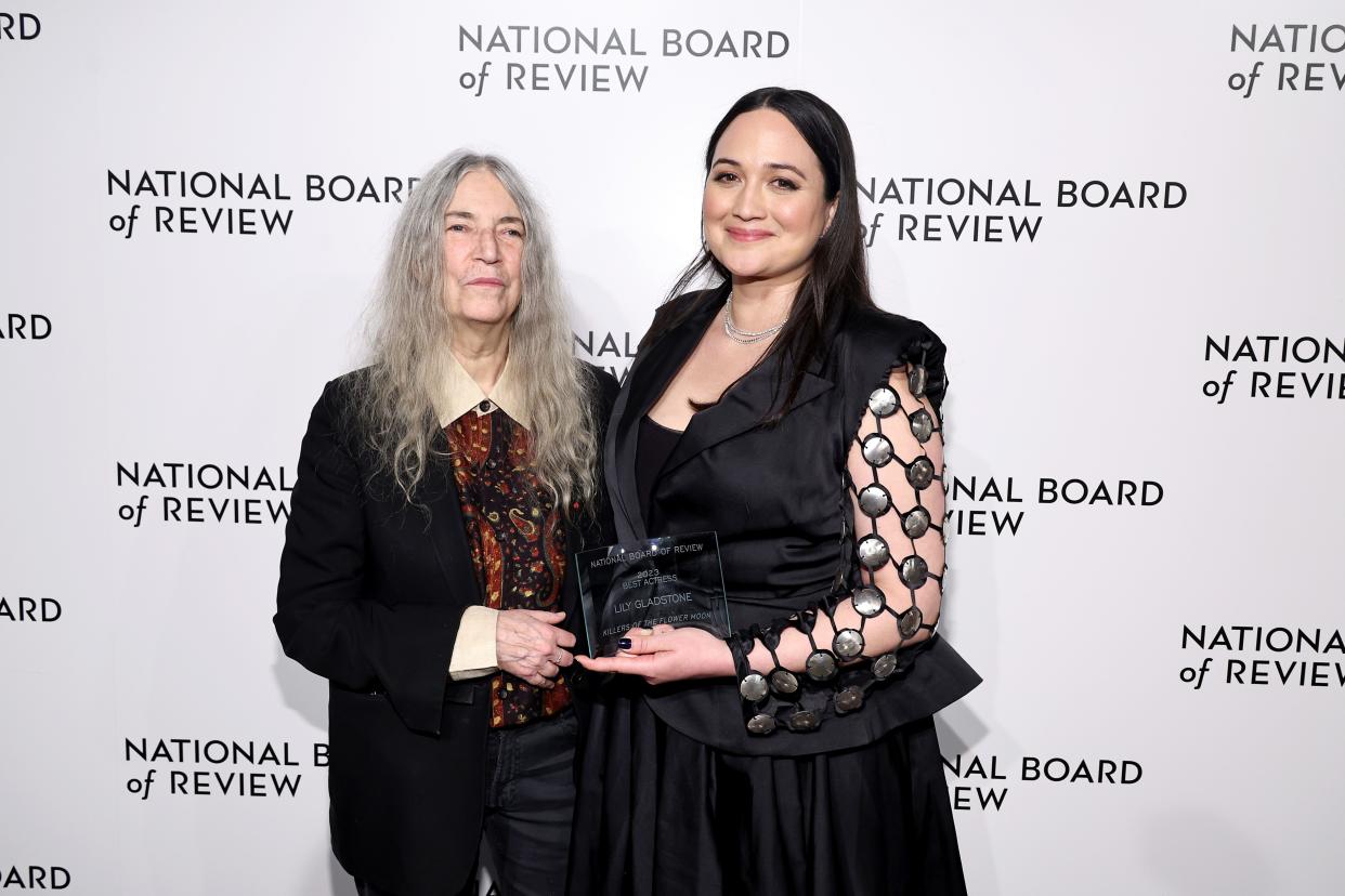 Patti Smith, left, and Lily Gladstone pose on the red carpet at the NBR awards gala Thursday in New York.