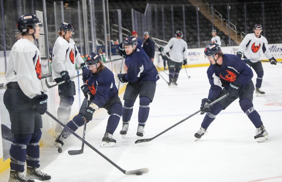 The Coachella Valley Firebirds practice for the first time on the main rink at Acrisure Arena in Thousand Palms, Calif., Dec. 12, 2022. 