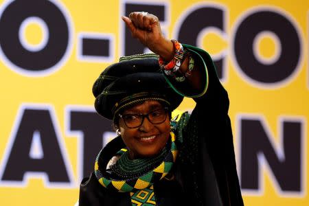 Winnie Madikizela Mandela, ex-wife of former South African president Nelson Mandela, gestures to supporters at the 54th National Conference of the ruling African National Congress (ANC) at the Nasrec Expo Centre in Johannesburg, South Africa December 16, 2017. REUTERS/Siphiwe Sibeko