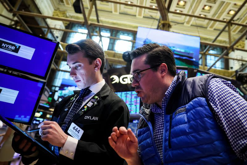 Traders work on the floor of the NYSE in New York