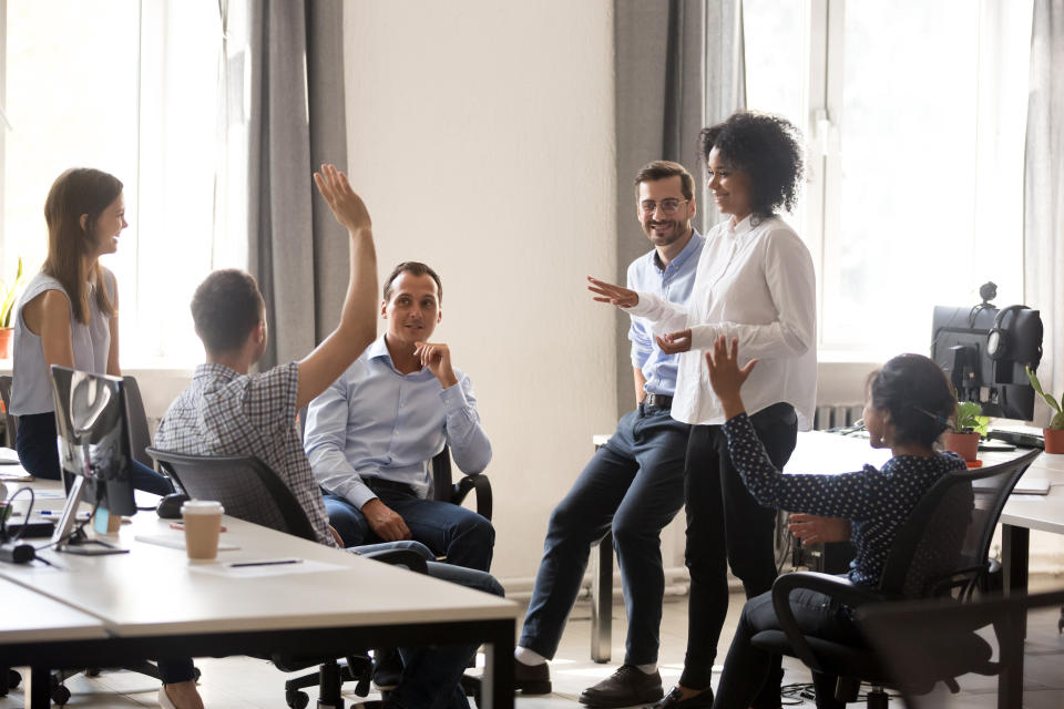 A diverse team collaborating in an office environment.