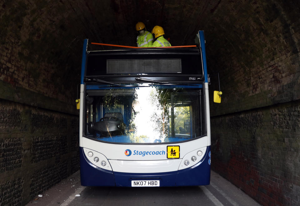 The scene on Well House Lane in Winchester after three children were taken to hospital with serious injuries while 12 others suffered minor injuries after the school bus they were travelling in crashed into a railway bridge.