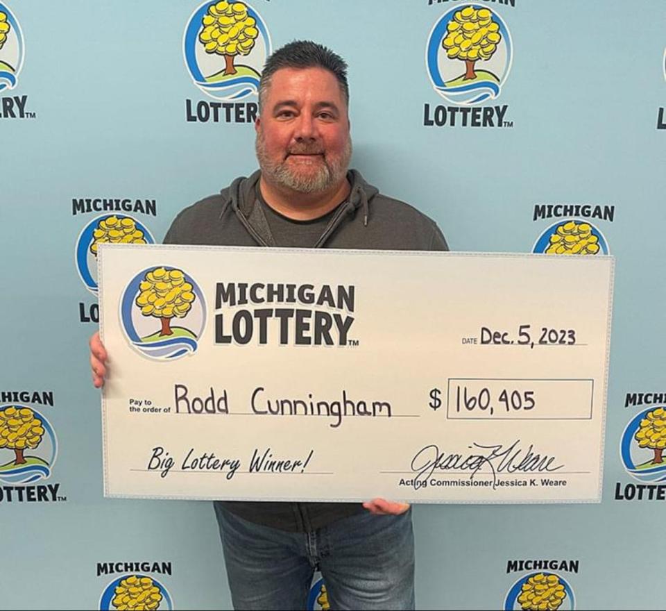 Rodd Cunningham with his check from winning the Lottery