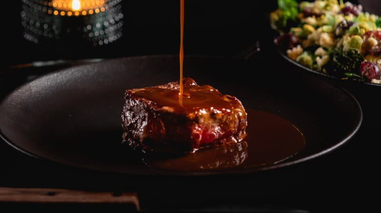 steak covered in sauce