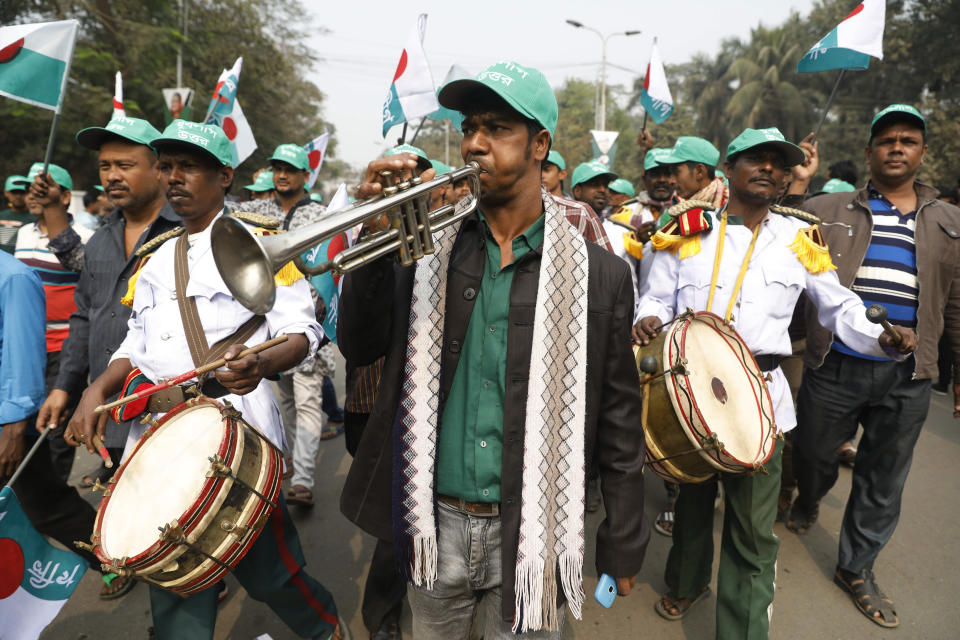 A music band performs during a rally celebrating the Awami League political party's overwhelming victory in last month's election in Dhaka, Bangladesh, Saturday, Jan. 19, 2019. (AP Photo)