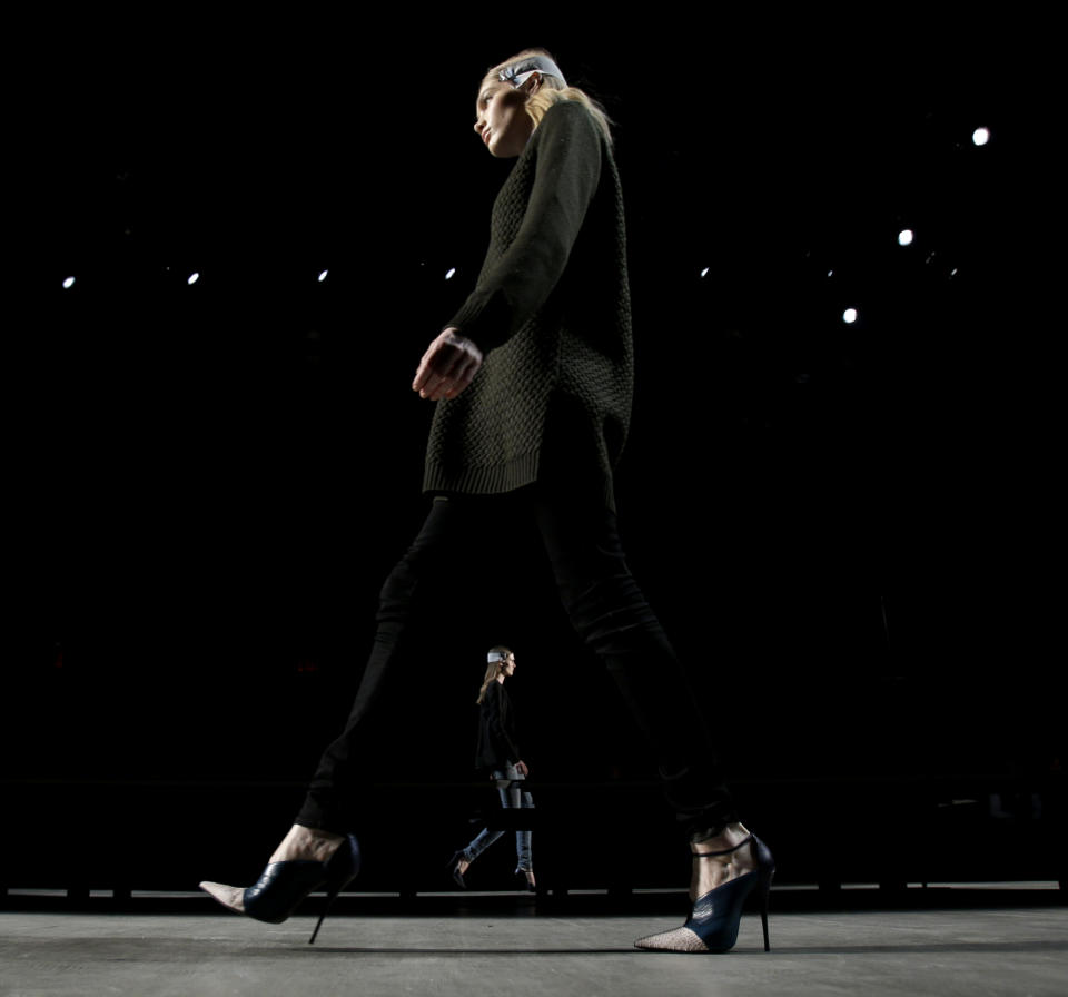 Models participate in a walk-through before the Narciso Rodriguez Fall 2013 collection is shown during Fashion Week in New York, Tuesday, Feb. 12, 2013. (AP Photo/Seth Wenig)