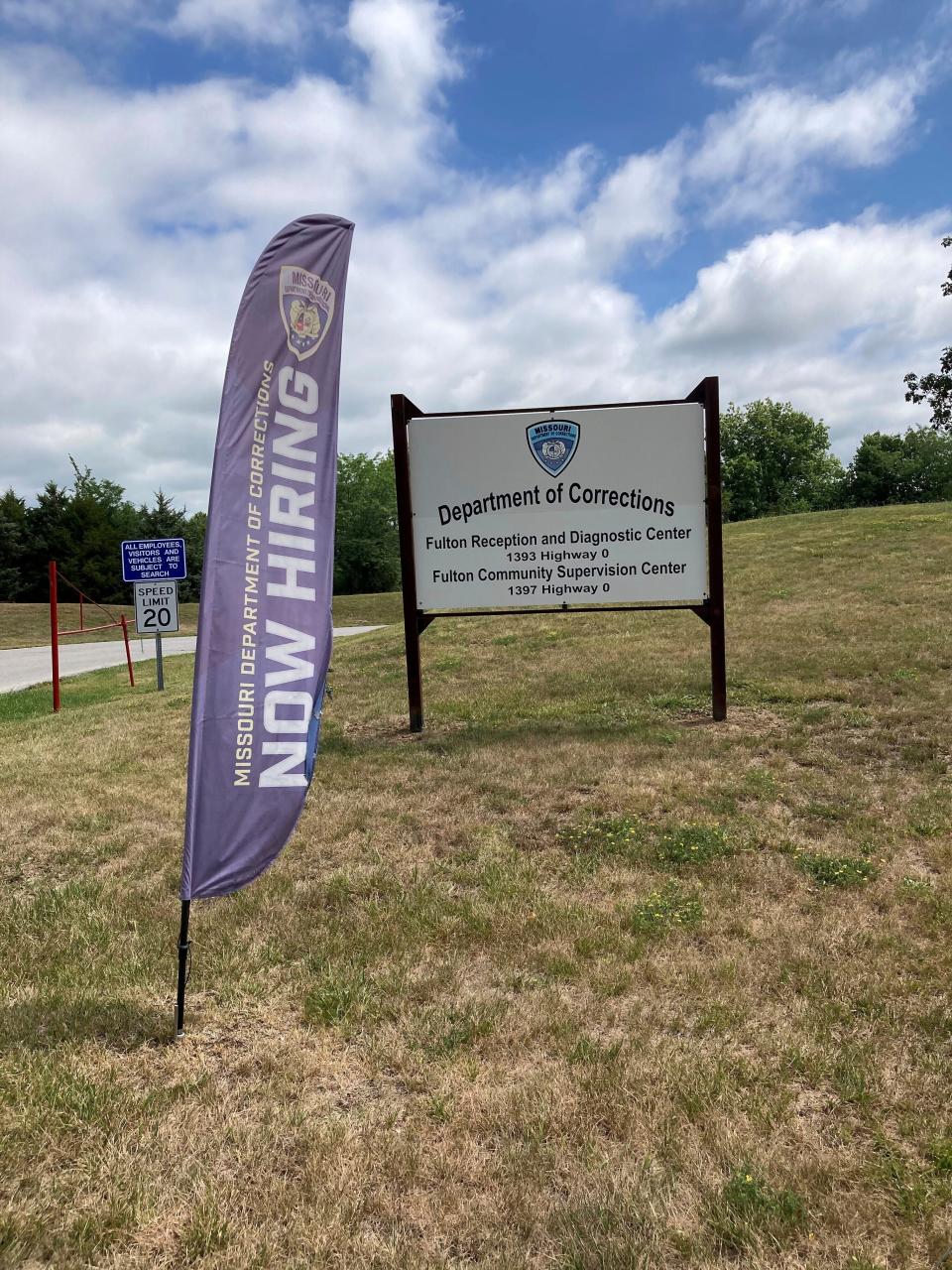 A "Now Hiring" sign is shown at the entrance to a Missouri Department of Corrections prison facility in July 2023 in Fulton, Missouri.