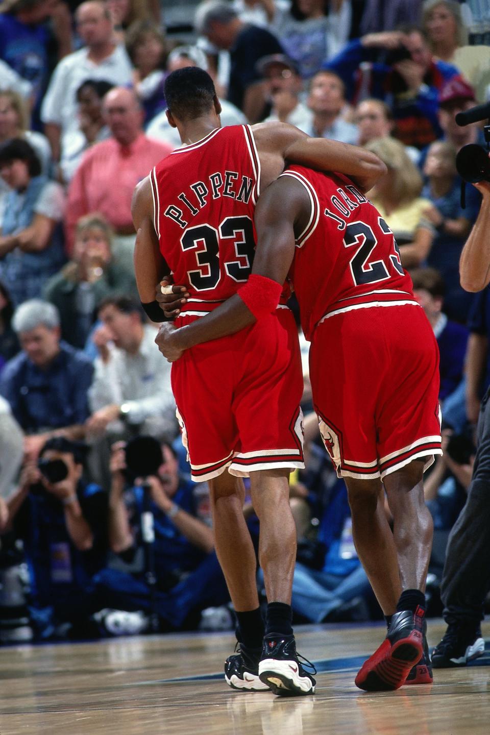 Michael Jordan is helped off the court by Scottie Pippen during his "flu game", Game 5 of the 1997 NBA Finals where he scored 38 points while battling stomach flu. (Getty Images)