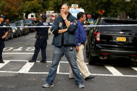 <p>A New York Fire Department official stands guard near a home that was destroyed by an explosion in the early morning in the Bronx borough of New York on Sept. 27, 2016. (Carlo Allegri/Reuters) </p>