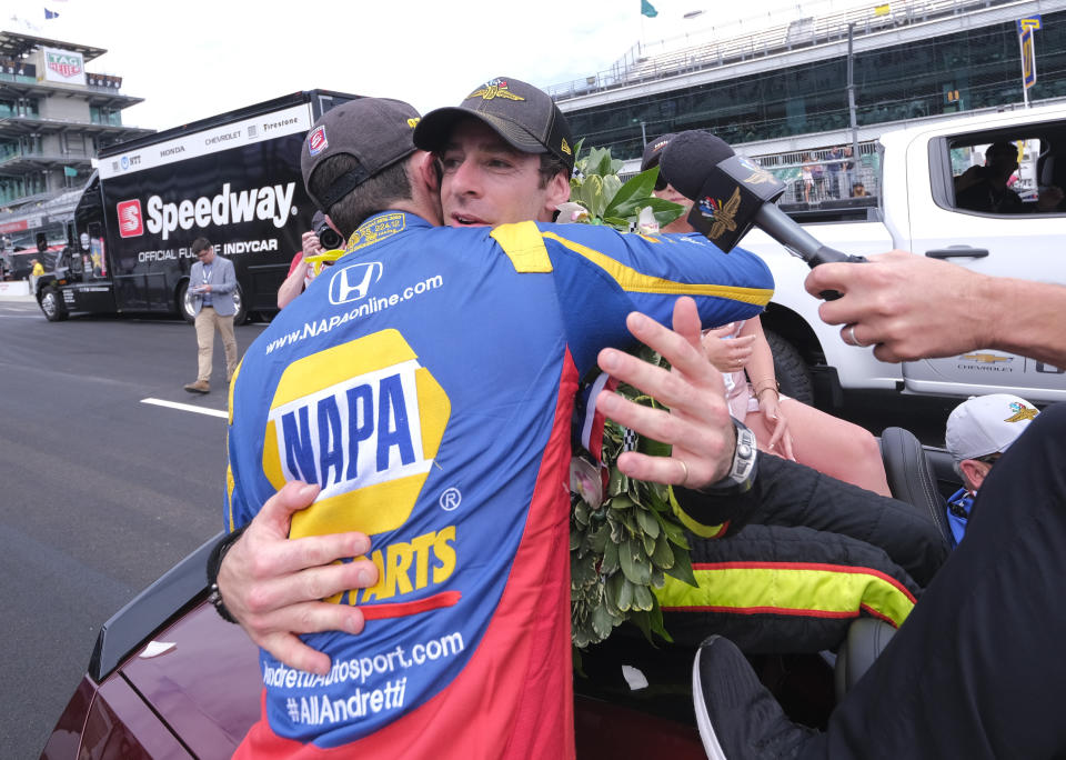 Simon Pagenaud, of France, rear, is hugged by Alexander Rossi, who finished second, after winning the Indianapolis 500 IndyCar auto race at Indianapolis Motor Speedway, Sunday, May 26, 2019, in Indianapolis. (AP Photo/AJ Mast)