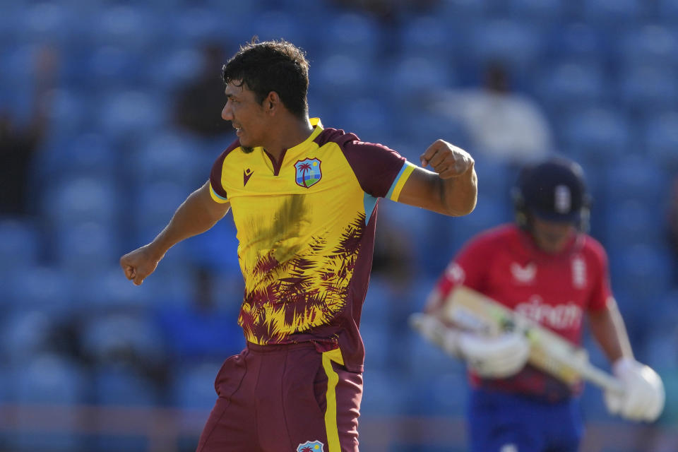 West Indies' Gudakesh Motie celebrates taking the wicket of England's Liam Livingstone during the second T20 cricket match at National Cricket Stadium in Saint George's, Grenada, Thursday, Dec. 14, 2023. (AP Photo/Ricardo Mazalan)