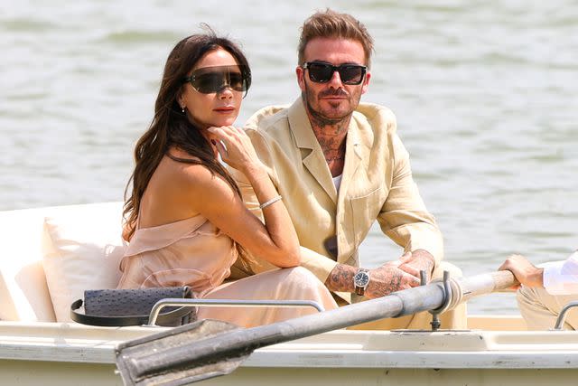 <p>Pierre Suu/WireImage</p> David Beckham and Victoria Beckham attend the Jacquemus' Fashion Show in Versailles, France in 2023.