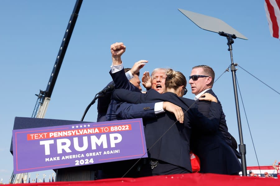 BUTLER, PENNSYLVANIA – JULY 13: Republican presidential candidate former President Donald Trump is rushed offstage during a rally on July 13, 2024 in Butler, Pennsylvania. (Photo by Anna Moneymaker/Getty Images)