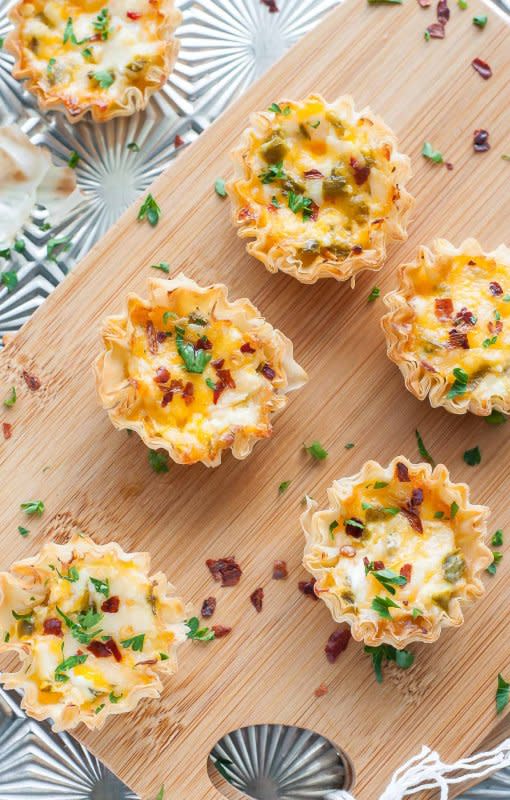 <p>Peas and Crayons</p><p>Easy to make and even easier to eat, these cheesy baked jalapeño popper phyllo cups are the ultimate appetizer! Everyone is sure to adore this jazzed up, bite-sized crowd-pleasing recipe!</p><p><strong>Get the recipe: <a href="https://peasandcrayons.com/2015/06/baked-jalapeno-popper-phyllo-cups.html" rel="nofollow noopener" target="_blank" data-ylk="slk:Baked Jalapeño Popper Phyllo Cups;elm:context_link;itc:0;sec:content-canvas" class="link "><em>Baked Jalapeño Popper Phyllo Cups</em></a></strong></p>