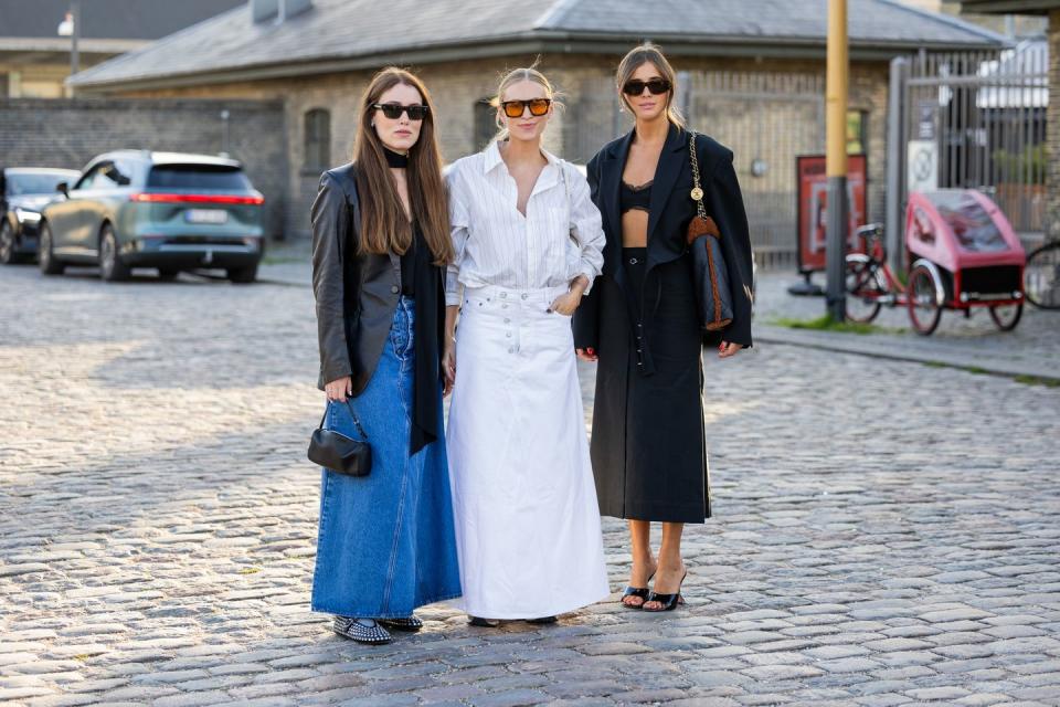 copenhagen, denmark august 10 annabel rosendahl wears denim skirt, black blazer tine andrea wears white striped button shirt skirt, bag darja barannik wears chanel bag, black skirt, blazer, laced top, heels outside ganni during the copenhagen fashion week springsummer 2024 on august 10, 2023 in copenhagen, denmark photo by christian vieriggetty images