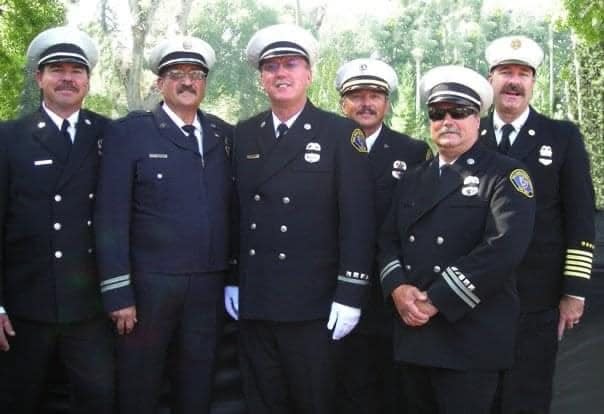 Fallen firefighter and Haz-Mat Specialist Greg Coon, center, flanked by his former fire service colleagues, left to right, Dale Priber, Mike Bier, Coon, Keith Petersen, Pete Lawson and Mike Mingee. Coon will be remembered during a service on July 26 in Apple Valley.