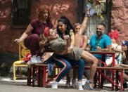 This image released by Warner Bros. Entertainment shows Dascha Polanco, from left, Daphne Rubin-Vega and Stephanie Beatriz in a scene from "In the Heights." (Macall Polay/Warner Bros. Entertainment via AP)