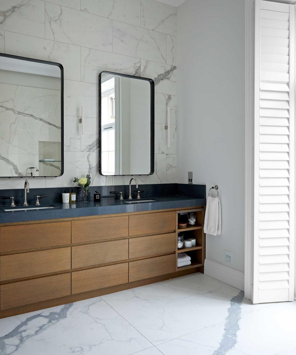 double vanity with cabinetry and mirrors