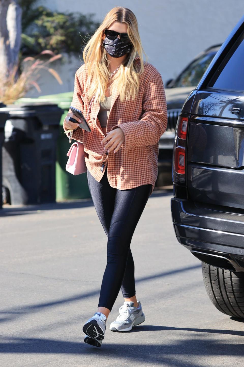 <p>Sofia Richie pairs a plaid coat and leggings, then heads out to a friend's house in L.A. on Wednesday.</p>