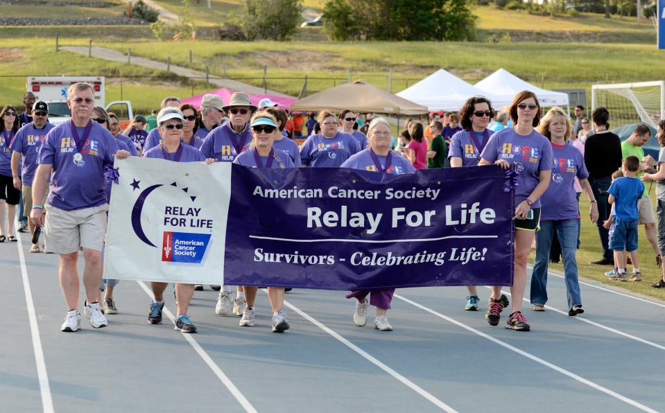 FILE - Cancer survivors walk the first lap at the Relay for Life event at Midland Valley High School in Graniteville on Friday, May 8, 2015. Richmond and Columbia Counties' Relay for Life is May 3.