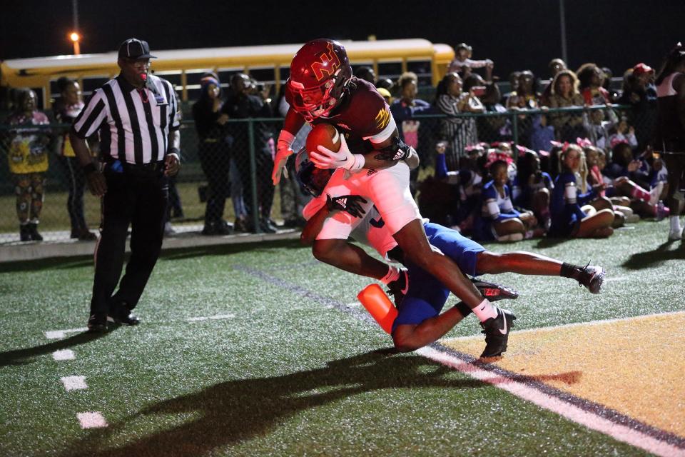 New Hampstead receiver Jaylen Hampton is taken out of bounds by Burke County's Jakari Crawford after making a touchdown catch in the end zone during Thursday night's game at Pooler Stadium.