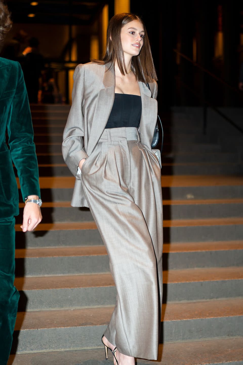 <p>Forget the floral maxi, an '80s power suit is a showstopping alternative wedding guest outfit, ideal for an evening reception in the city and worn masterfully by Kaia Gerber, of course, as she attended Marc Jacobs' big day.</p>