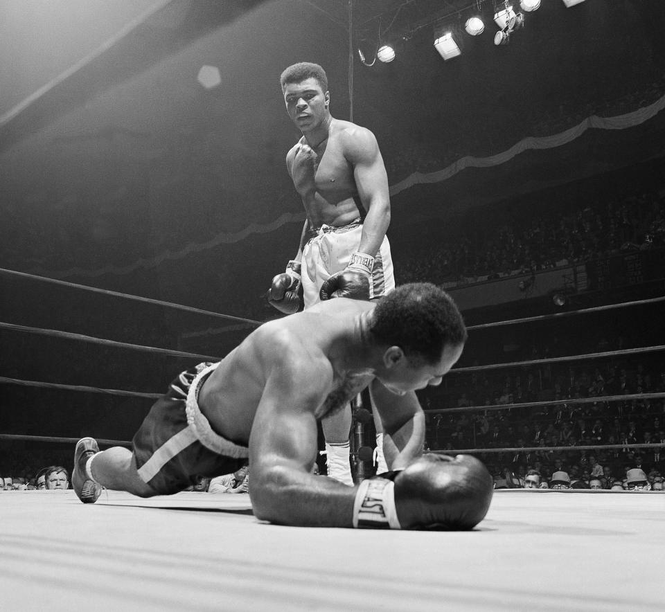 Zora Folley, left, moves in on champion Cassius Clay (Muhammad Ali) in first round of their heavyweight title fight in New York's Madison Square Garden March 22, 1967. (AP Photo)