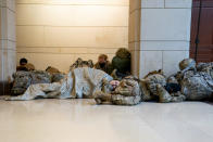 WASHINGTON, DC - JANUARY 13: Members of the National Guard sleep on the floor of the U.S. Capitol on January 13, 2021 in Washington, DC. Security has been increased throughout Washington following the breach of the U.S. Capitol last Wednesday, and leading up to the Presidential inauguration. (Photo by Stefani Reynolds/Getty Images)