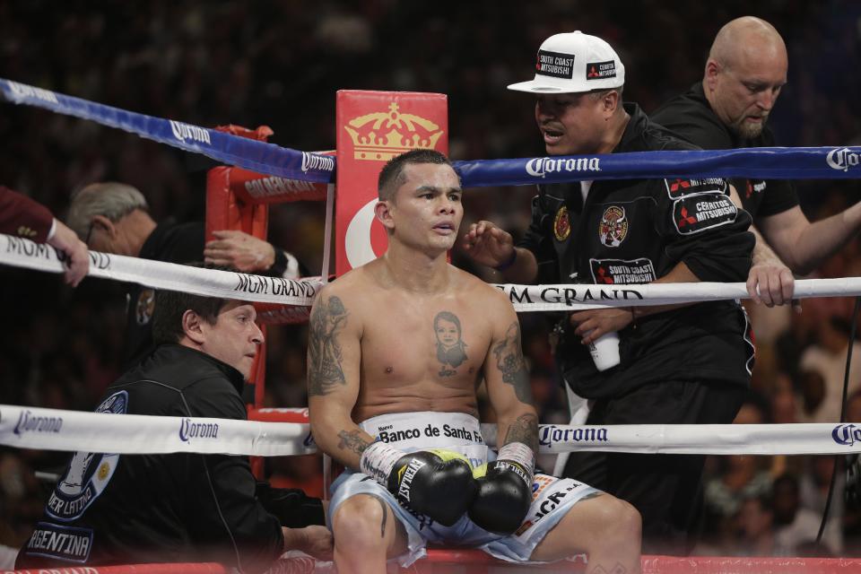 Marcos Maidana, from Argentina, sits in his corner during his WBC-WBA welterweight title boxing fight against Floyd Mayweather Jr. Saturday, May 3, 2014, in Las Vegas. (AP Photo/Isaac Brekken)