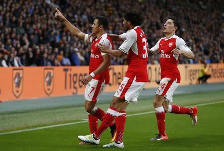 Football Soccer Britain - Hull City v Arsenal - Premier League - The Kingston Communications Stadium - 17/9/16 Arsenal's Alexis Sanchez celebrates with team mates after scoring their third goal Reuters / Russell Cheyne/ Livepic