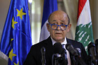 French Foreign Minister Jean-Yves Le Drian, and his Lebanese counterpart Nassif Hitti, hold a news conference following their meeting at the Lebanese foreign ministry in Beirut, Lebanon, Thursday, July. 23, 2020. Le Drian met with Lebanon's president Thursday at the start of his two-day visit to the Mediterranean country that is witnessing the worst economic crisis of its modern history. (AP Photo/Bilal Hussein)