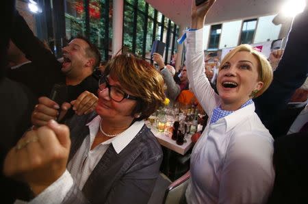 People at the Free Democratic Party FDP headquarters react on first exit polls in the German general election (Bundestagswahl) in Berlin, Germany, September 24, 2017. REUTERS/Ralph Orlowski